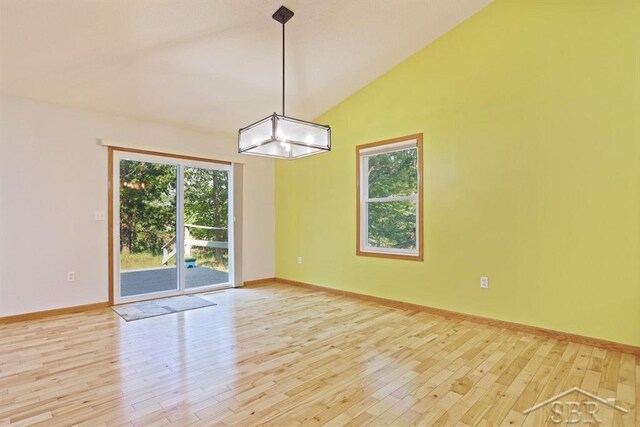 878 S Crooked Tree Ln, Midland, MI 48640 - unfurnished room with light wood-style flooring and vaulted ceiling