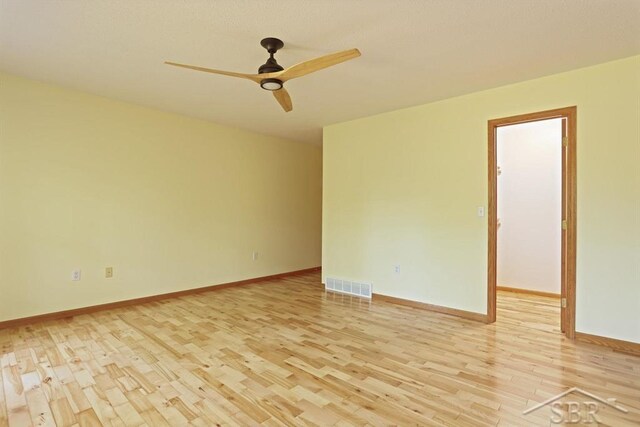 878 S Crooked Tree Ln, Midland, MI 48640 - unfurnished room featuring light wood-style floors and a ceiling fan