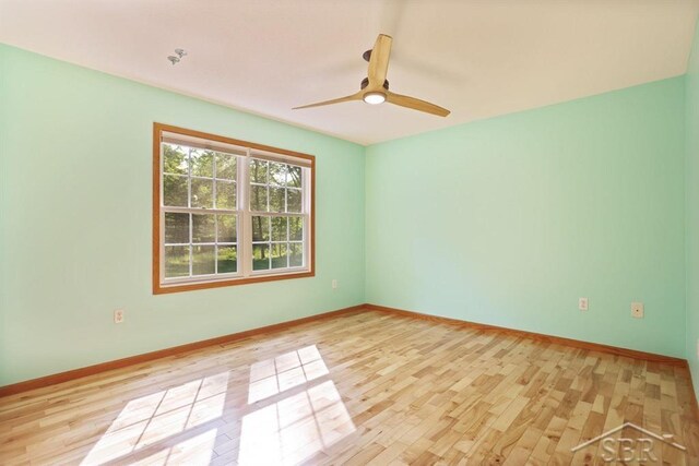 878 S Crooked Tree Ln, Midland, MI 48640 - unfurnished room featuring light wood-style floors and a ceiling fan
