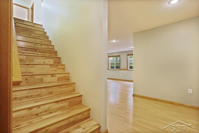 878 S Crooked Tree Ln, Midland, MI 48640 - stairs with wood finished floors and recessed lighting