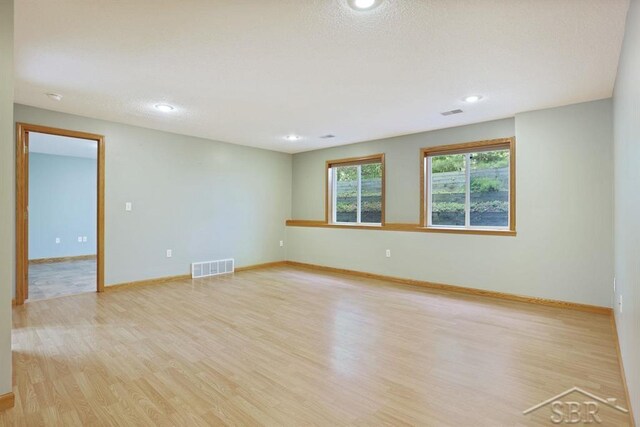 878 S Crooked Tree Ln, Midland, MI 48640 - spare room featuring light wood-style flooring and recessed lighting