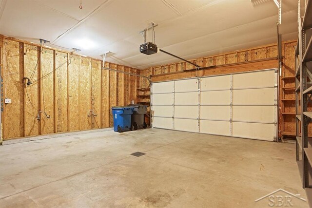 878 S Crooked Tree Ln, Midland, MI 48640 - garage with a garage door opener