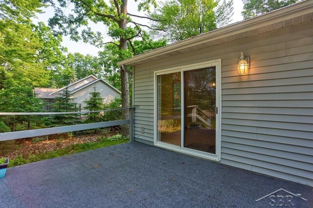 878 S Crooked Tree Ln, Midland, MI 48640 - doorway to property with a patio
