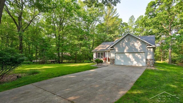 878 S Crooked Tree Ln, Midland, MI 48640 - view of front of house with an attached garage, concrete driveway, a front lawn, and stone siding