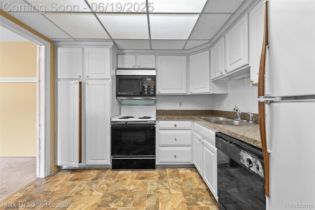 1111 N Old Woodward Ave, Birmingham, MI 48009 - kitchen with freestanding refrigerator, dishwasher, stainless steel microwave, electric stove, and white cabinets