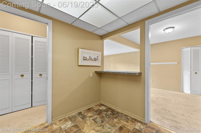 1111 N Old Woodward Ave, Birmingham, MI 48009 - hall with baseboards and stone finish floors