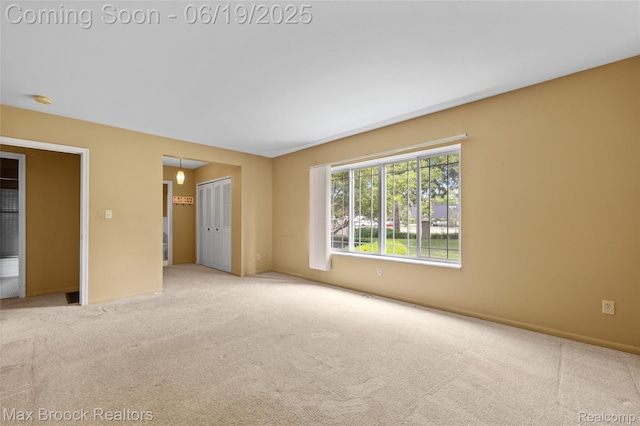 1111 N Old Woodward Ave, Birmingham, MI 48009 - carpeted spare room featuring a smoke detector and baseboards