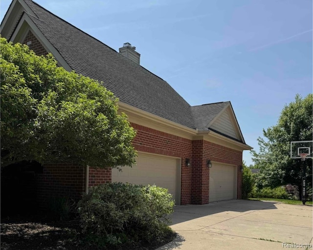 49941 Baychester Blvd, Canton, MI 48187 - view of side of home featuring brick siding, a shingled roof, driveway, and a chimney