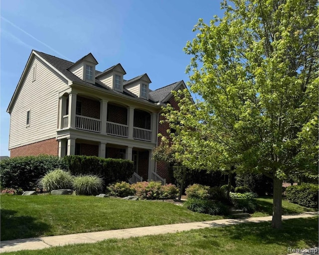 49941 Baychester Blvd, Canton, MI 48187 - view of home's exterior featuring brick siding, a balcony, and a yard