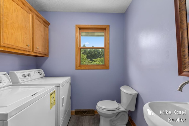 2742 Woodridge Dr, Jenison, MI 49428 - laundry room with washer and clothes dryer and dark wood finished floors