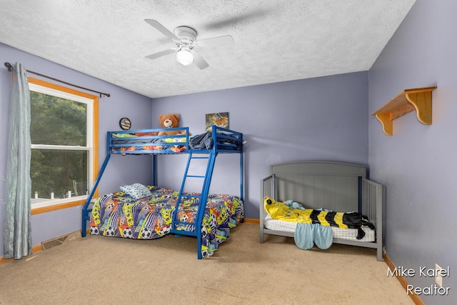 2742 Woodridge Dr, Jenison, MI 49428 - bedroom with a textured ceiling, carpet floors, and ceiling fan