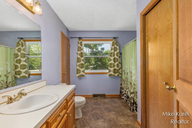 2742 Woodridge Dr, Jenison, MI 49428 - full bath with vanity, healthy amount of natural light, and stone finish flooring