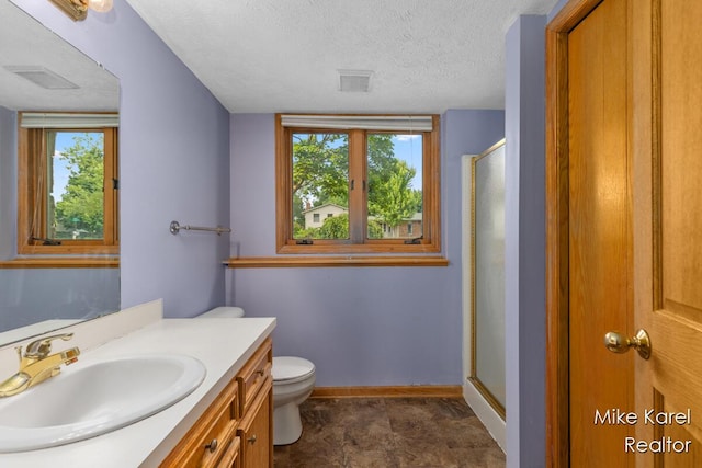 2742 Woodridge Dr, Jenison, MI 49428 - bathroom featuring vanity, a stall shower, plenty of natural light, and a textured ceiling