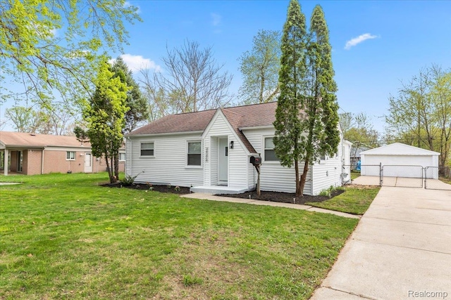 24270 Columbus Ave, Warren, MI 48089 - view of front of property with an outbuilding, a garage, and a gate