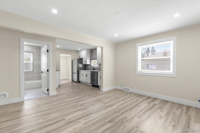 24270 Columbus Ave, Warren, MI 48089 - unfurnished living room featuring light wood-style flooring and recessed lighting