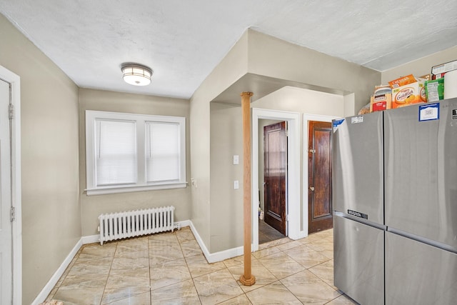 14311 Forrer St, Detroit, MI 48227 - kitchen featuring freestanding refrigerator and radiator