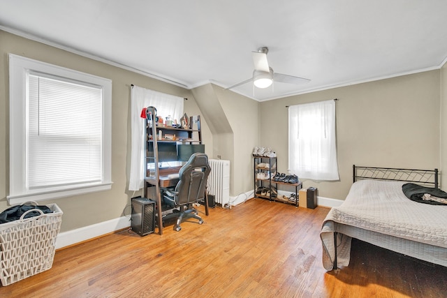 14311 Forrer St, Detroit, MI 48227 - bedroom featuring radiator, ornamental molding, a desk, light wood finished floors, and ceiling fan