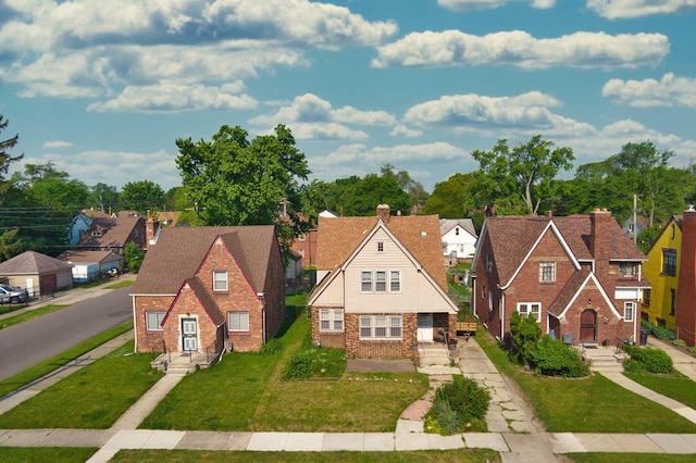 14311 Forrer St, Detroit, MI 48227 - english style home featuring a residential view, brick siding, and a front lawn