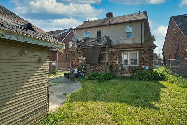 14311 Forrer St, Detroit, MI 48227 - rear view of property featuring a chimney, stucco siding, and brick siding
