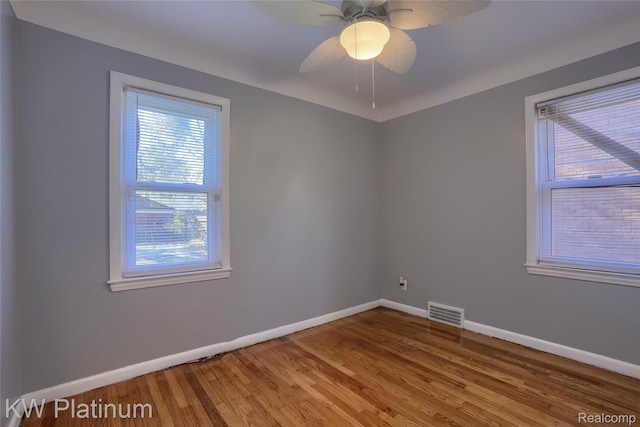16054 Carlisle St, Detroit, MI 48205 - unfurnished room with plenty of natural light, wood finished floors, and a ceiling fan