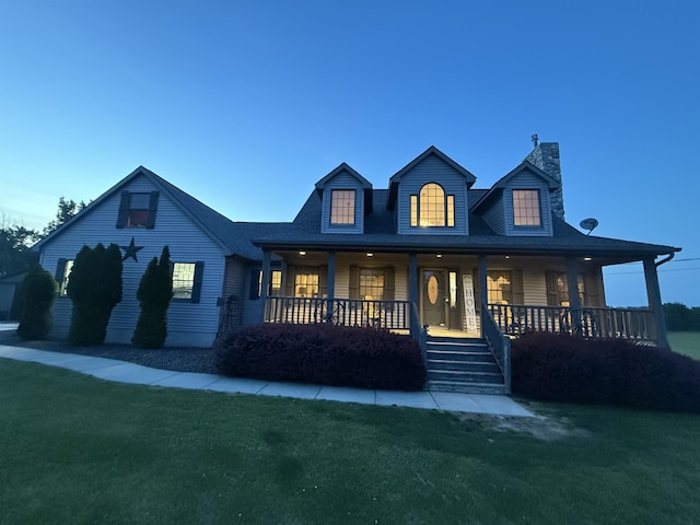 6360 Ray Rd, Swartz Creek, MI 48473 - view of front of property with a front yard, a chimney, and covered porch