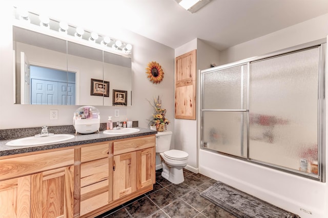 6360 Ray Rd, Swartz Creek, MI 48473 - bathroom featuring double vanity, tile patterned flooring, and bath / shower combo with glass door