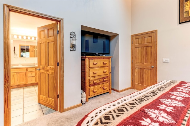 6360 Ray Rd, Swartz Creek, MI 48473 - bedroom with a high ceiling, light colored carpet, and ensuite bathroom