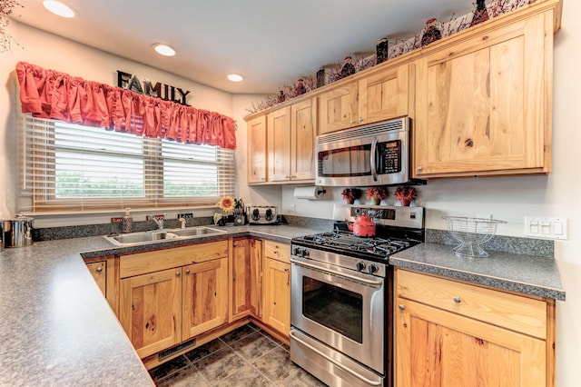 6360 Ray Rd, Swartz Creek, MI 48473 - kitchen with appliances with stainless steel finishes, dark countertops, recessed lighting, and light brown cabinets