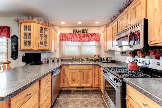 6360 Ray Rd, Swartz Creek, MI 48473 - kitchen featuring stainless steel appliances, dark countertops, glass insert cabinets, and recessed lighting