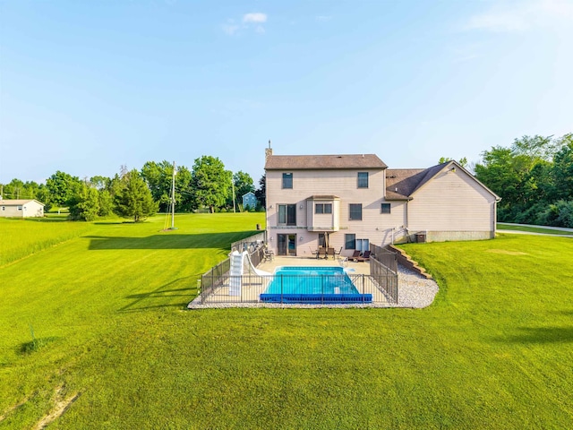6360 Ray Rd, Swartz Creek, MI 48473 - rear view of property with a yard and a patio