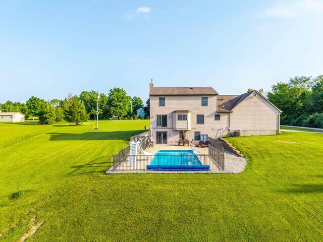 6360 Ray Rd, Swartz Creek, MI 48473 - rear view of property featuring a yard and a patio
