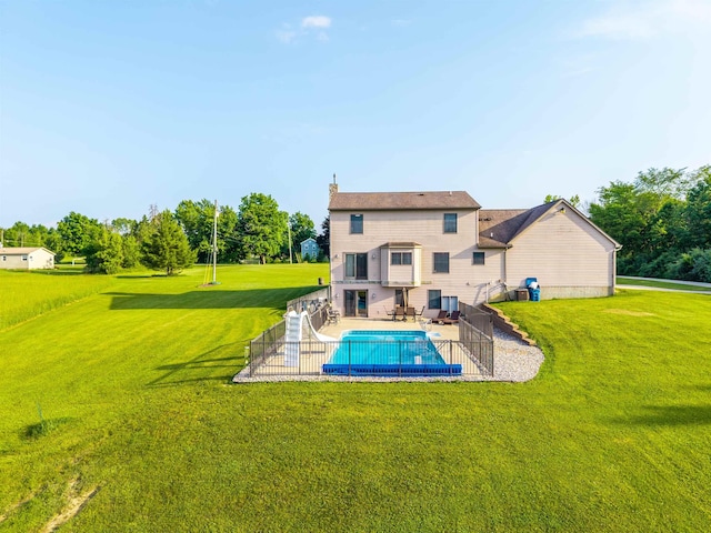 6360 Ray Rd, Swartz Creek, MI 48473 - rear view of property with a lawn and a patio area