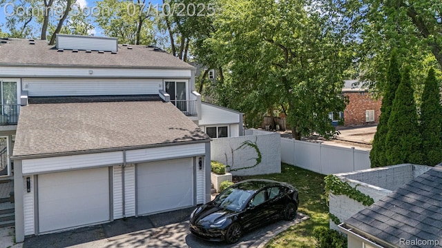 418 E 5th St Unit 2, Royal Oak, MI 48067 - view of home's exterior featuring a shingled roof and a balcony