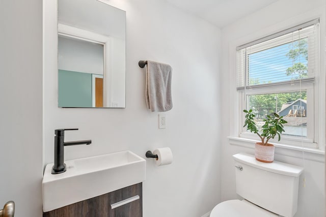 2646 Forest Grove Ave SW, Wyoming, MI 49519 - half bathroom featuring toilet and vanity