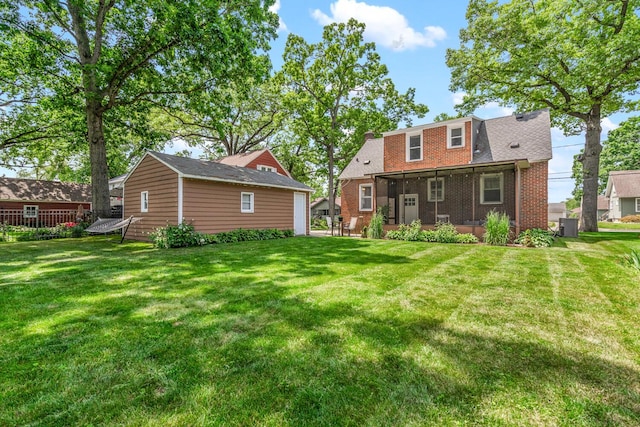 2646 Forest Grove Ave SW, Wyoming, MI 49519 - rear view of property featuring a lawn and brick siding