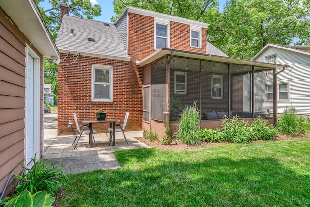 2646 Forest Grove Ave SW, Wyoming, MI 49519 - back of house with a sunroom, brick siding, a shingled roof, and a patio area