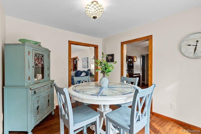 316 N Seymour Rd, Flushing, MI 48433 - dining room featuring wood finished floors and baseboards