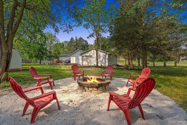 316 N Seymour Rd, Flushing, MI 48433 - view of patio featuring a fire pit and an outdoor structure