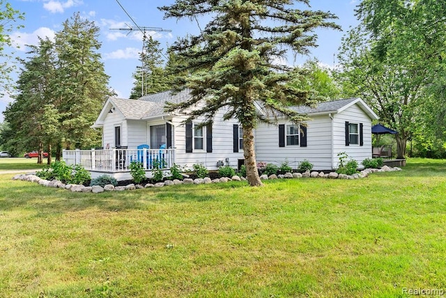 316 N Seymour Rd, Flushing, MI 48433 - view of front of home with a front lawn, a deck, a gazebo, and a shingled roof