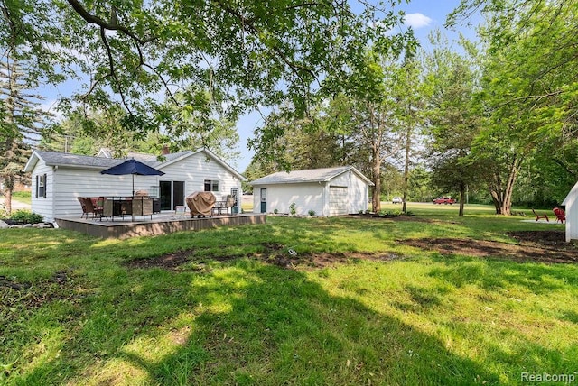 316 N Seymour Rd, Flushing, MI 48433 - view of grassy yard with an outbuilding and a deck