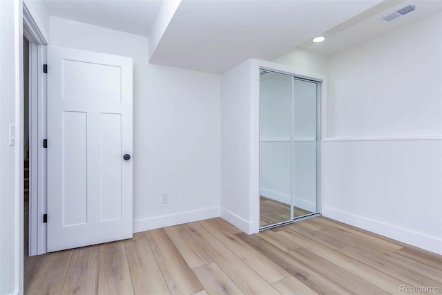 47387 Royal Rd, Macomb, MI 48044 - unfurnished bedroom featuring wood finished floors, recessed lighting, and a closet
