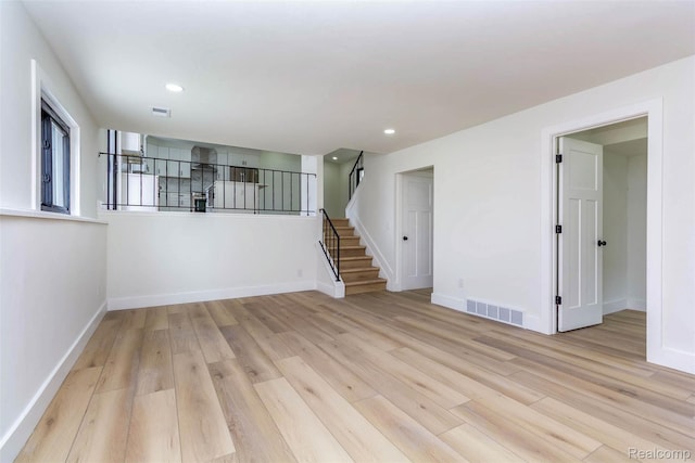 47387 Royal Rd, Macomb, MI 48044 - spare room with light wood-style flooring, stairway, and recessed lighting