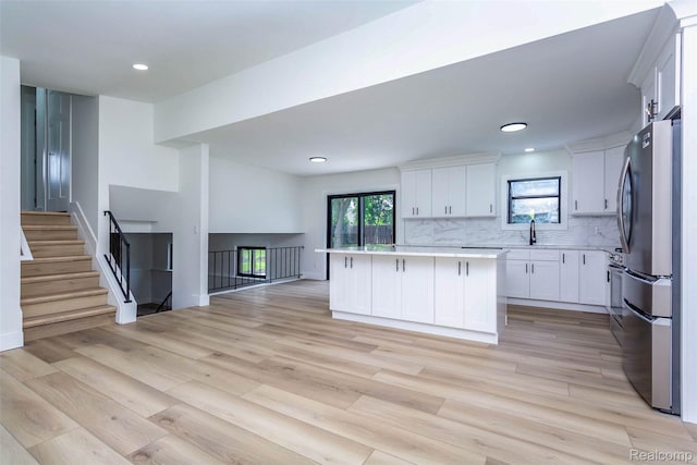 47387 Royal Rd, Macomb, MI 48044 - kitchen featuring freestanding refrigerator, open floor plan, light countertops, light wood-style floors, and recessed lighting
