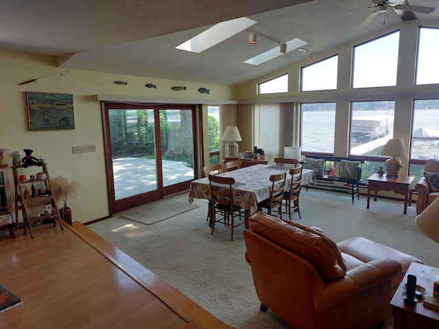 23675 N Shore Dr, Edwardsburg, MI 49112 - dining room with lofted ceiling, healthy amount of natural light, ceiling fan, and a skylight