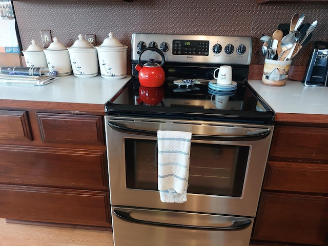 23675 N Shore Dr, Edwardsburg, MI 49112 - kitchen with stainless steel range with electric cooktop and light countertops