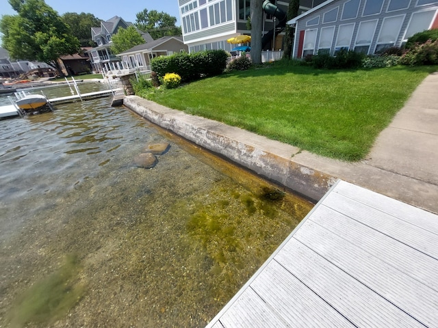 23675 N Shore Dr, Edwardsburg, MI 49112 - dock area featuring a water view and a lawn