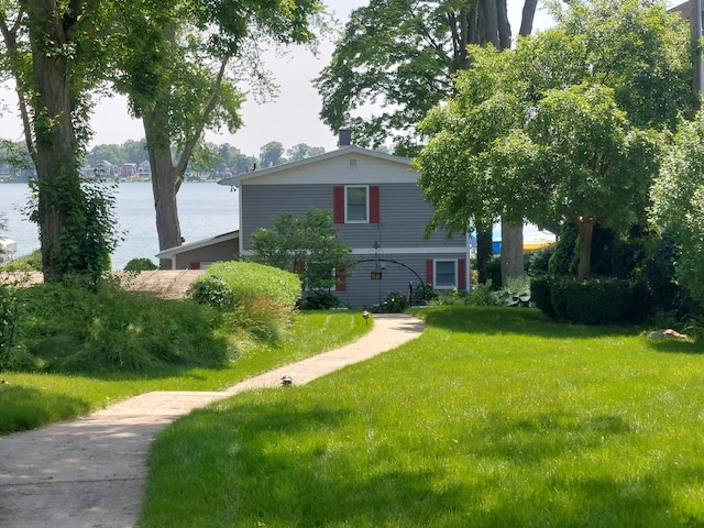 23675 N Shore Dr, Edwardsburg, MI 49112 - view of front of home with a water view and a front yard
