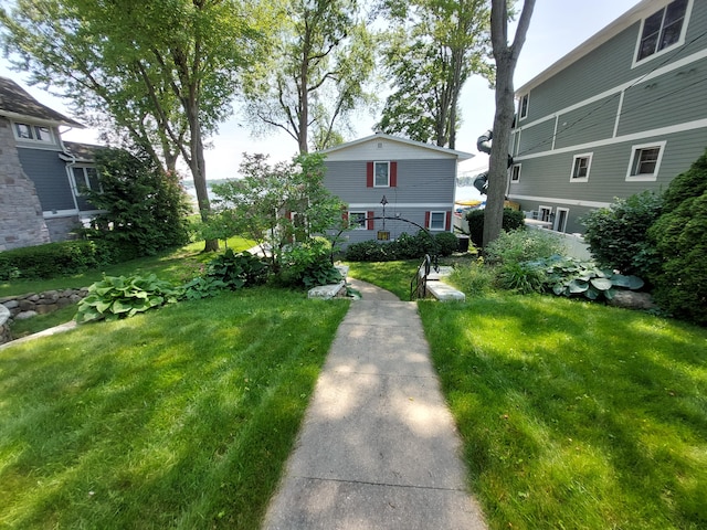 23675 N Shore Dr, Edwardsburg, MI 49112 - view of front of house with a front yard
