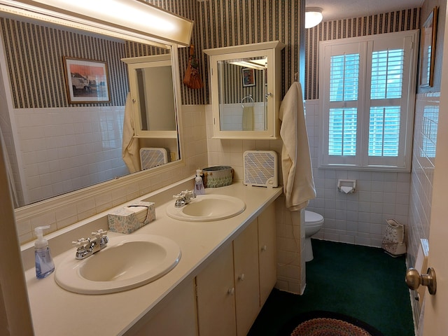 23675 N Shore Dr, Edwardsburg, MI 49112 - bathroom with tile walls, wallpapered walls, and double vanity