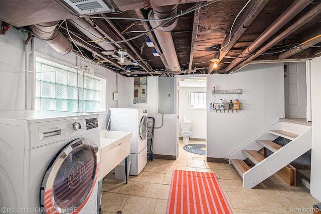 1407 W Marshall St, Ferndale, MI 48220 - laundry room featuring washer and clothes dryer, electric panel, and light tile patterned flooring